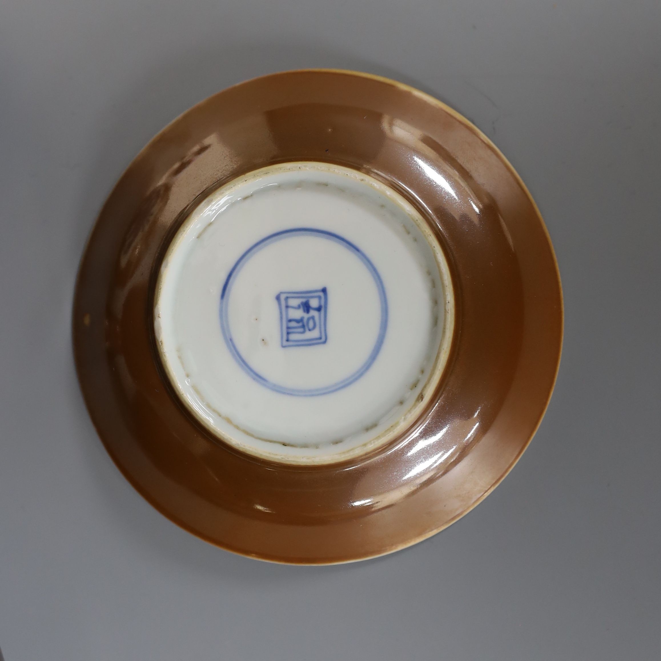 A Chinese cafe au lait glazed saucer, three bowls and a stem cup